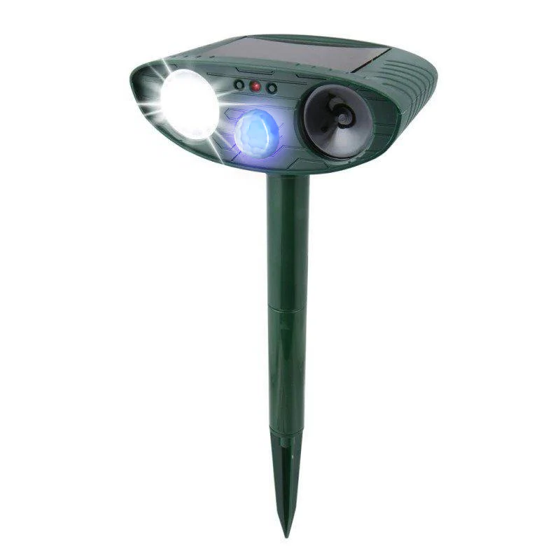 Solar ultrasonic cat repeller protecting an outdoor garden. Motion-activated & eco-friendly pest control.