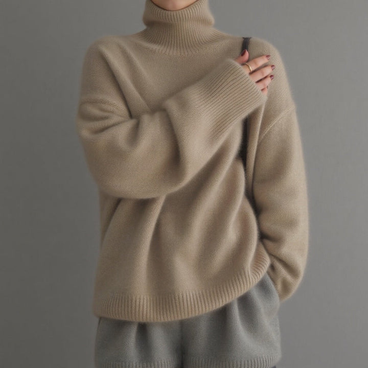 Women's oversized turtleneck sweater, cozy knit, chic winter fashion, comfortable relaxed fit.