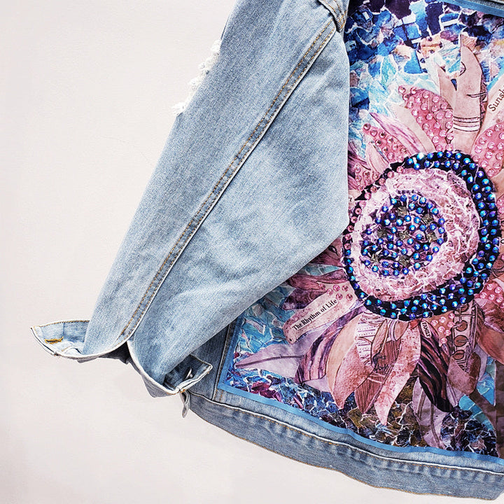 Statement women's denim jacket, 'Lynn' model, featuring a distinctive back print. Versatile for casual street style looks.