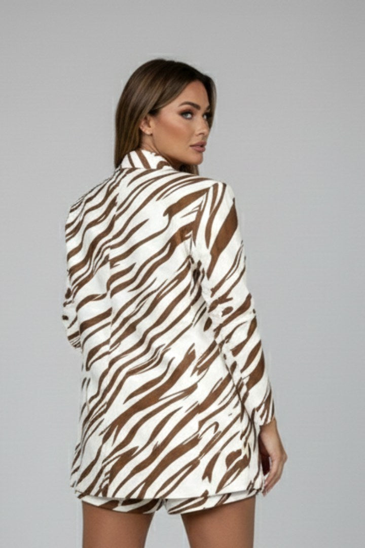 Fashionable women's animal print blazer with matching shorts. Trendy two-piece co-ord set.