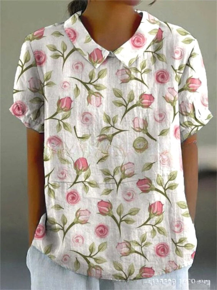 Relaxed fit women's floral print short sleeve top, ideal for casual summer or spring outfits.