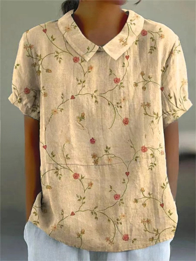 Elegant women's short sleeve floral top, comfortable and chic for warm weather.