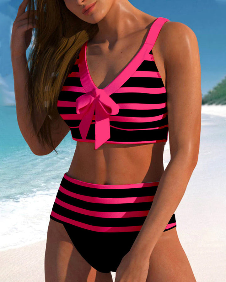 Elegant women's high-waisted striped bikini, comfortable and chic beachwear.