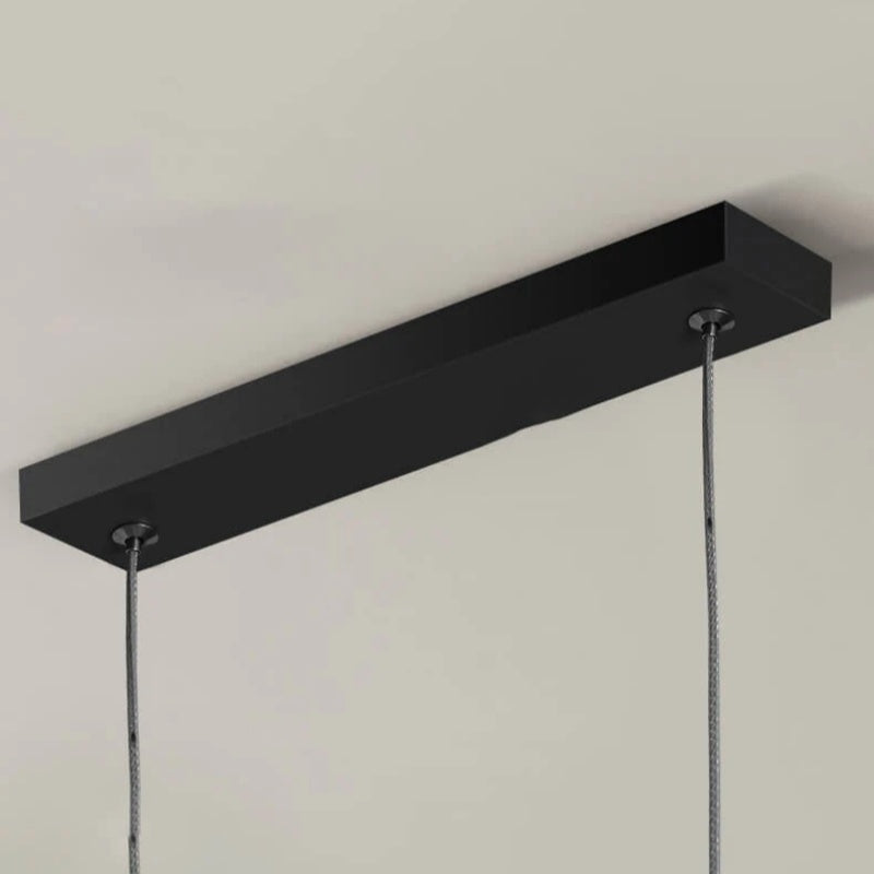 Black and gold Arisha LED chandelier, an adjustable modern light for dining spaces.