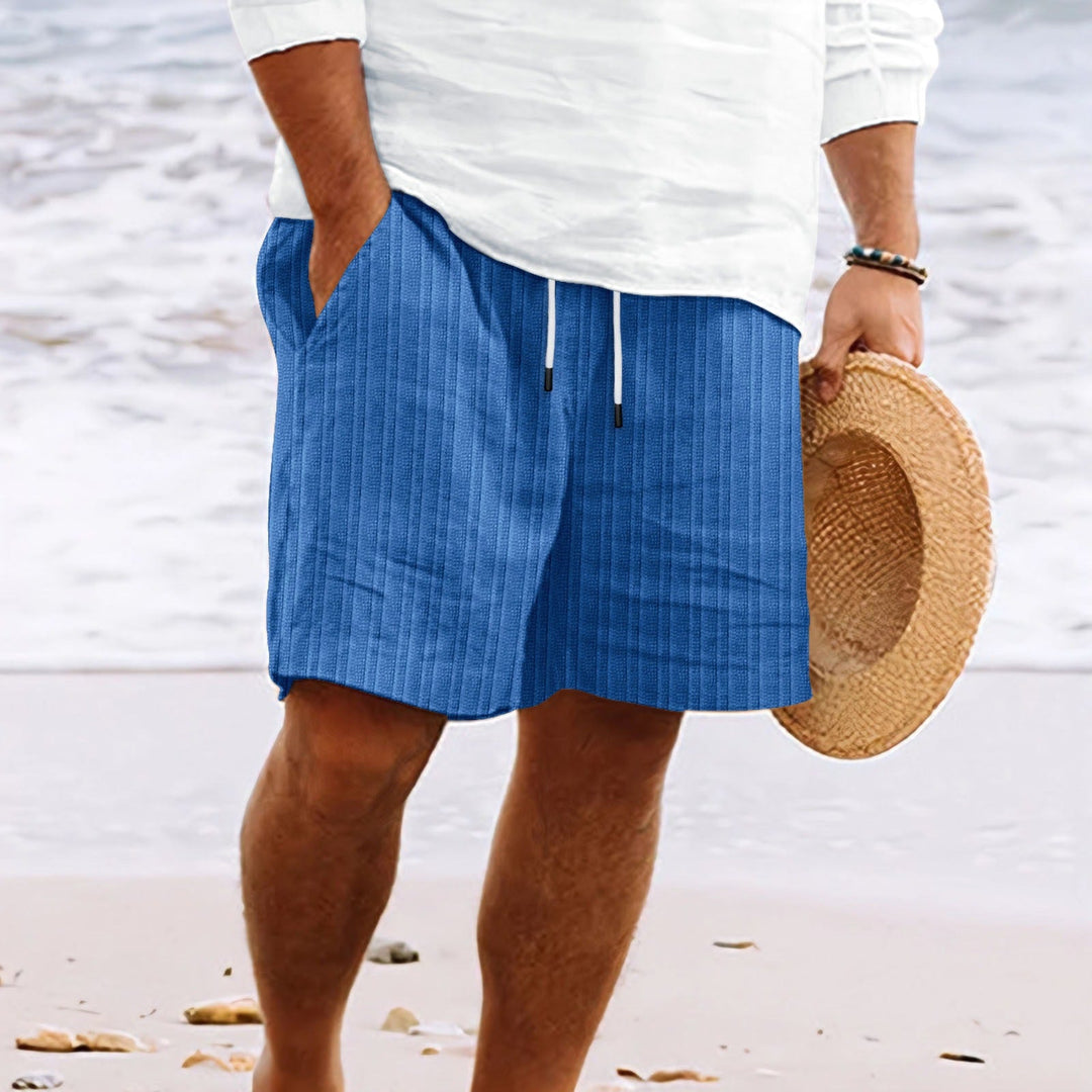 Casual men's summer linen shorts. Features ribbed design, drawstring waist & pockets. Relaxed fit, beach ready.