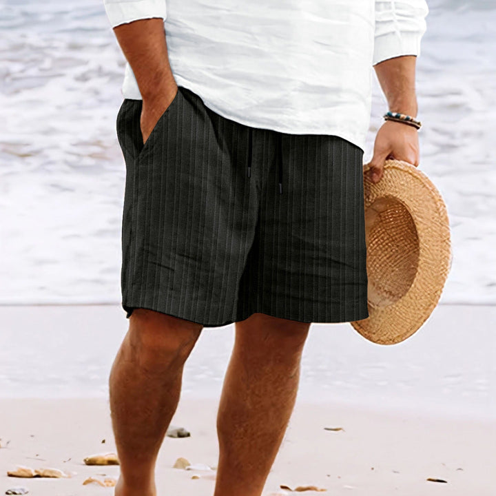 Versatile men's linen ribbed shorts with drawstring. Ideal for warm weather, casual outings, or beachwear.
