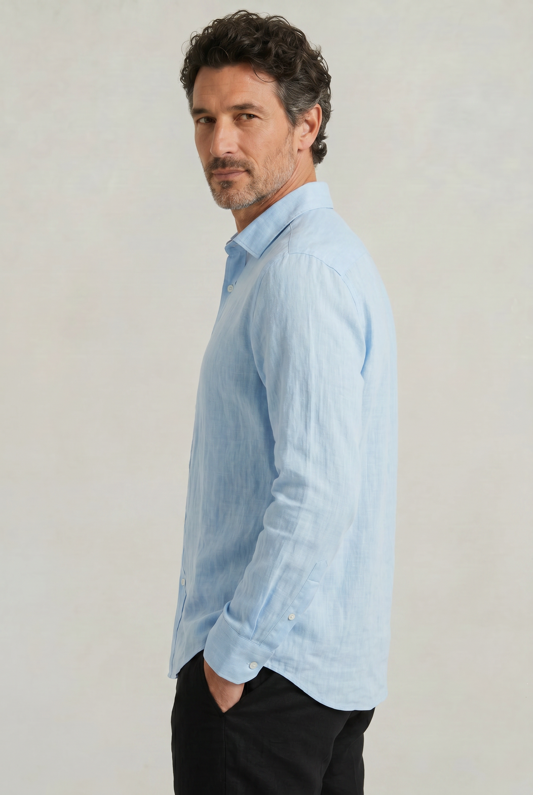 Casual button-down men's shirt with unique texture. Versatile for smart casual looks.