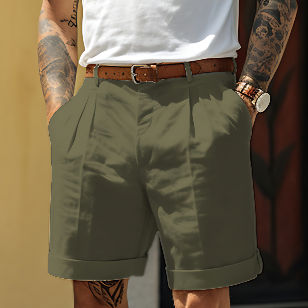 Close-up of men's refined tailored shorts featuring neat pleats, a comfortable fit, and quality fabric.
