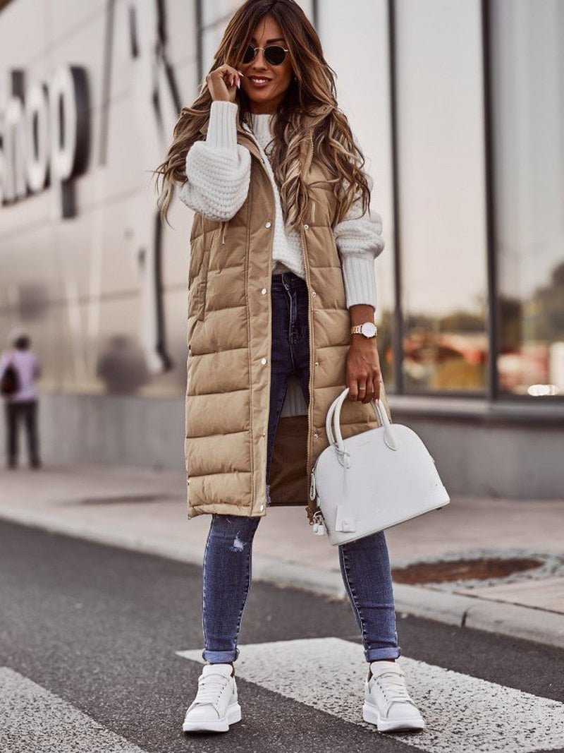 Black women's long quilted puffer jacket, stylish & warm winter coat for ultimate outdoor comfort.