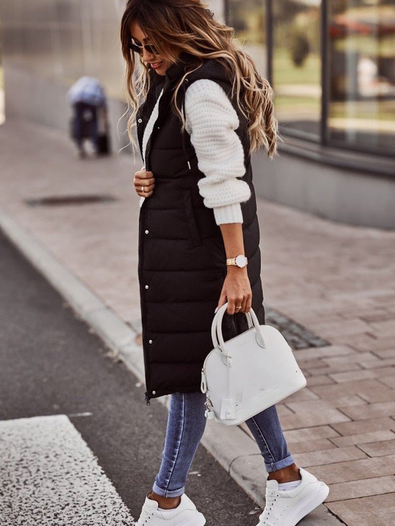 Warm women's long quilted puffer jacket in black, ideal winter outerwear for cold weather protection.
