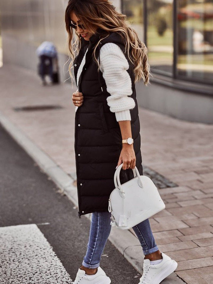Warm women's long quilted puffer jacket in black, ideal winter outerwear for cold weather protection.