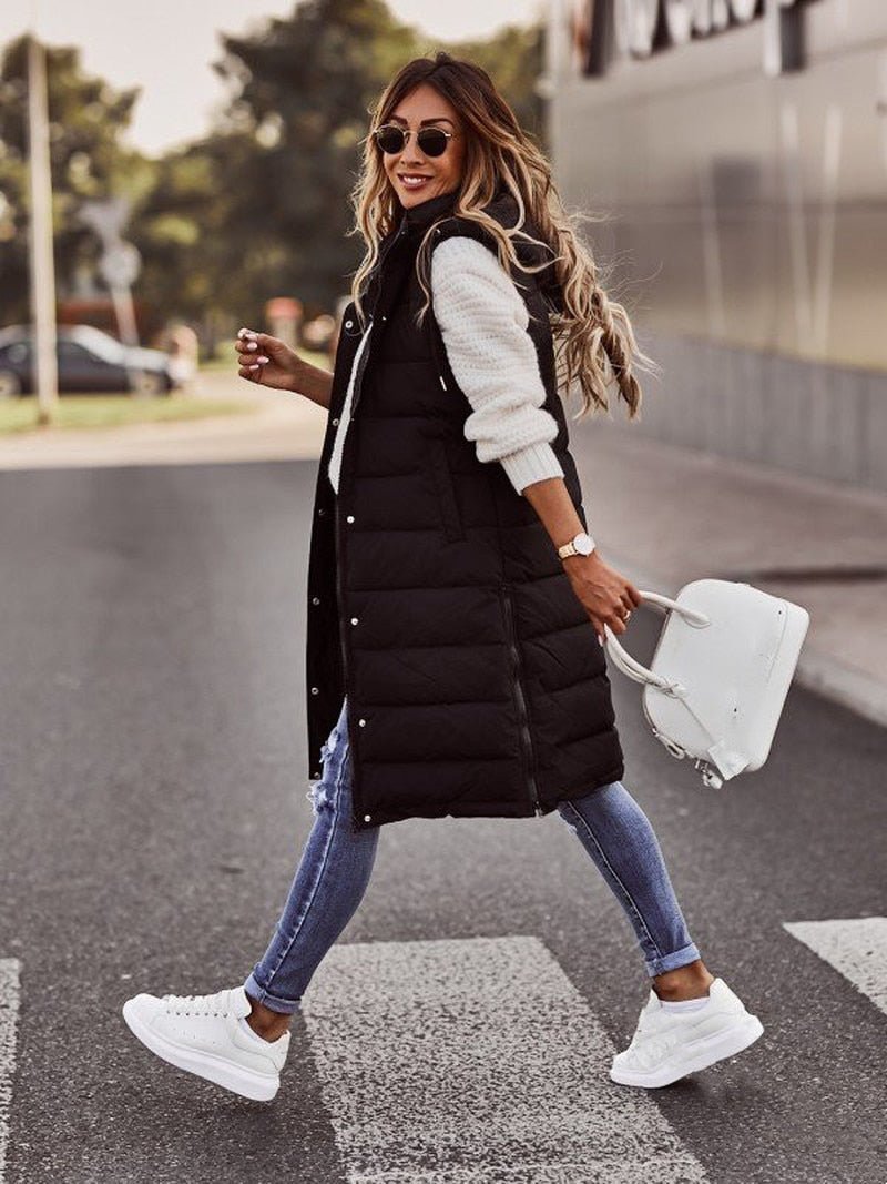 Stylish long quilted puffer jacket for women in beige, a warm winter coat designed for maximum comfort.