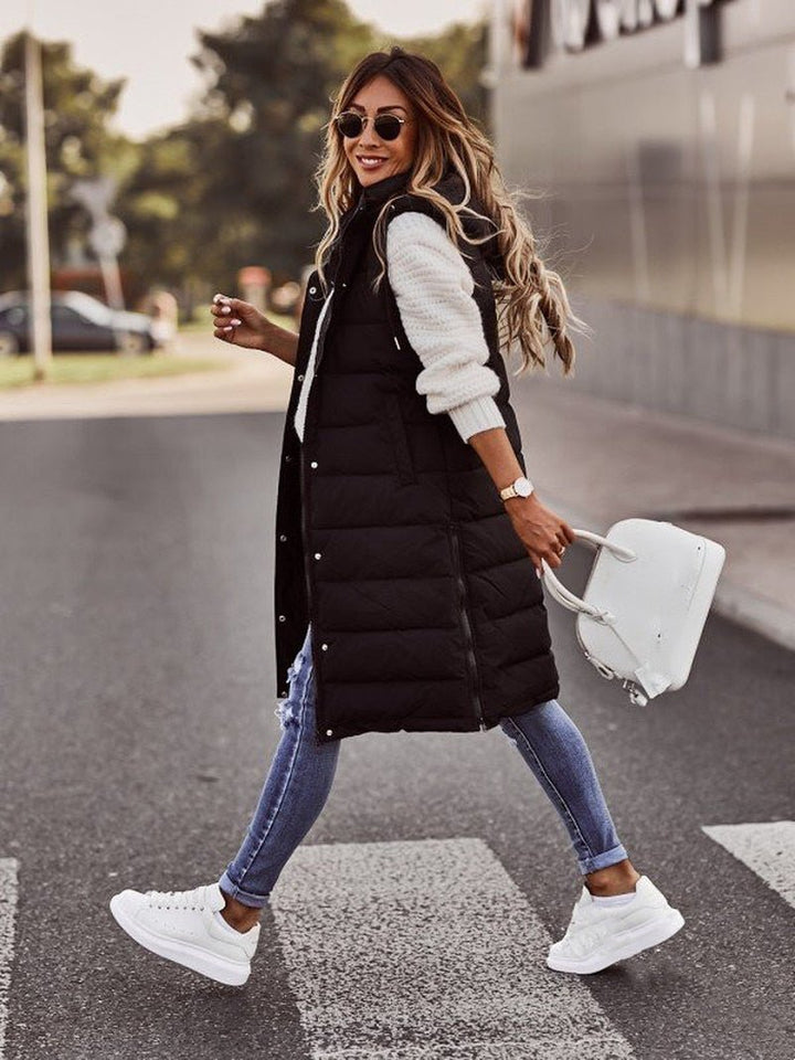 Stylish long quilted puffer jacket for women in beige, a warm winter coat designed for maximum comfort.