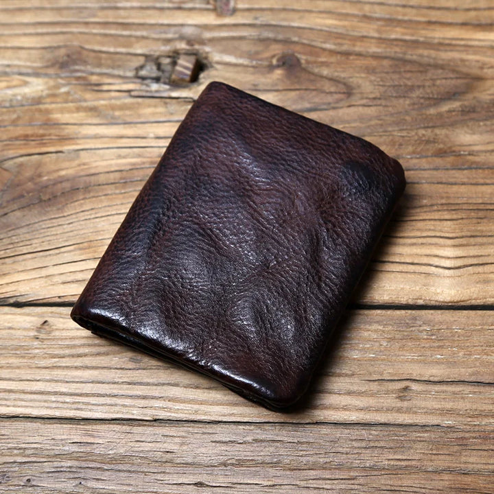 Classic black full-grain leather men's wallet, durable & secure, developing unique patina over time.