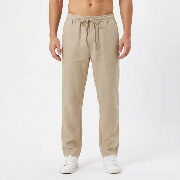 Beige men's relaxed fit linen pants, featuring a straight leg and drawstring for ultimate comfort.