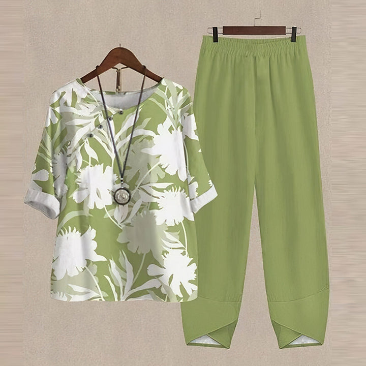 Full shot of a model wearing a women's floral two-piece set, highlighting the graceful silhouette & summer fashion.