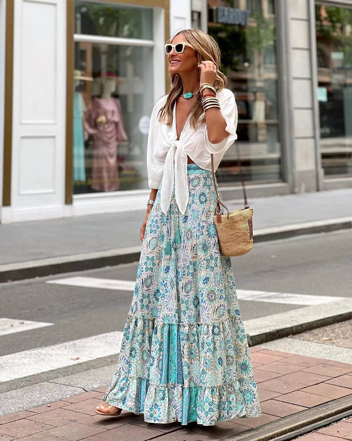 Elegant women's floral A-line midi dress with flowing silhouette, perfect for autumn casual wear.