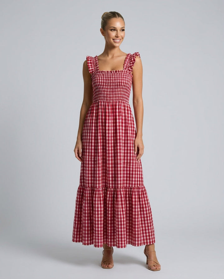 Detail of ruffle strap & smocked bodice on a women's gingham maxi dress. Elegant summer design.