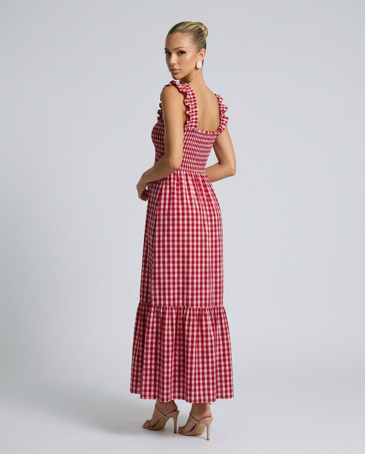 Woman in beige gingham maxi dress, ruffle strap & smocked bodice. Breezy casual summer look.