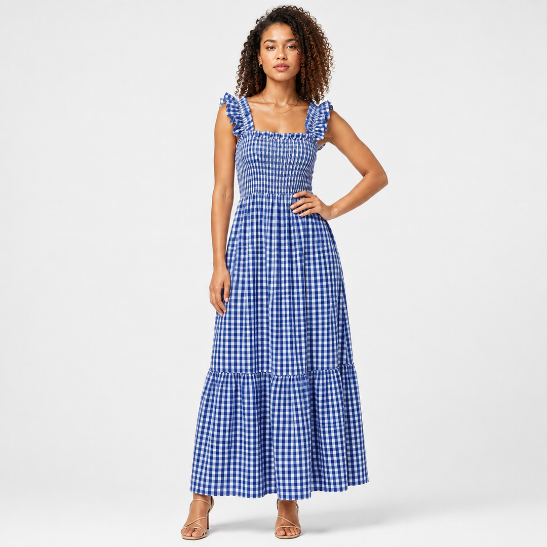 Woman in red gingham maxi dress, chic ruffle strap & smocked bodice. Stylish for summer events.