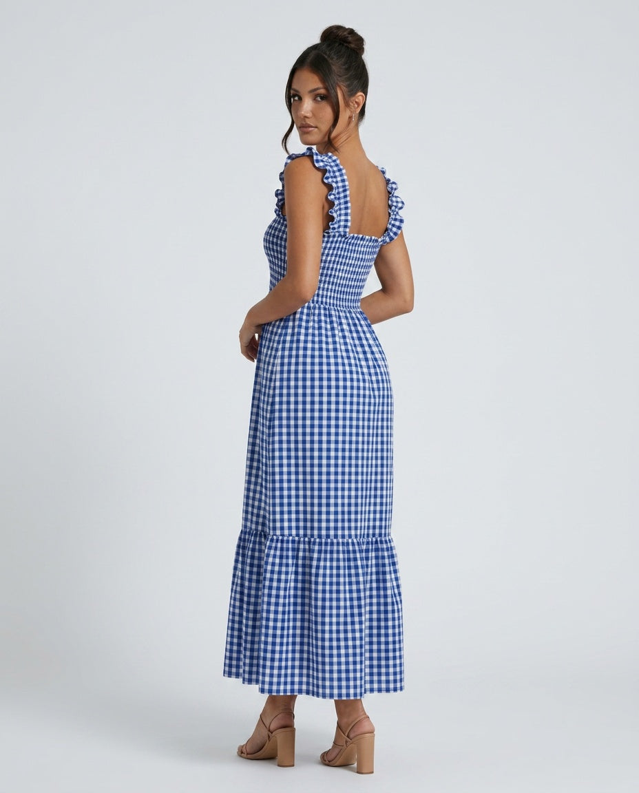 Woman in blue gingham maxi dress, breezy ruffle strap & smocked bodice. Casual comfortable summer wear.