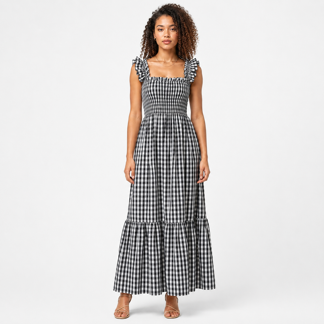 Front view of women's chic gingham maxi dress with ruffle straps and smocked bodice. Summer fashion.