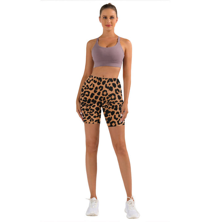 Fashionable women's leopard print workout shorts, high-waisted design with convenient pockets.
