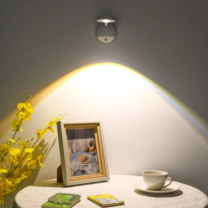Sleek wireless LED motion spotlight, rechargeable & dimmable. Smart interior lighting for modern living spaces.