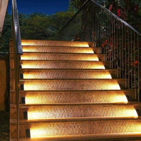 Bright LED solar stair lights illuminating outdoor steps, enhancing safety and garden decor at dusk.