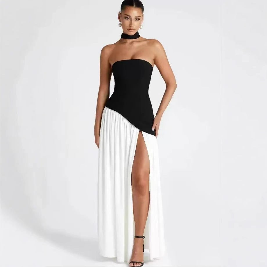 Sophisticated pleated formal gown, strapless design, and high slit for a chic wedding guest look.