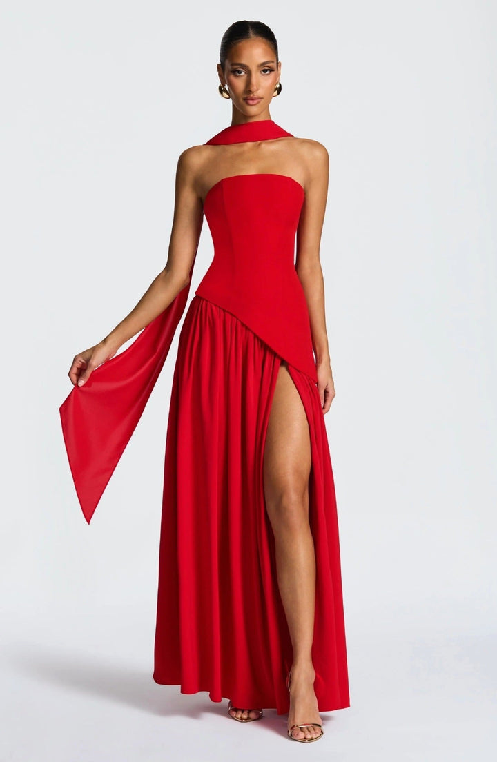 Long women's strapless formal gown, a pleated maxi dress with a high leg slit, ideal for evening parties.