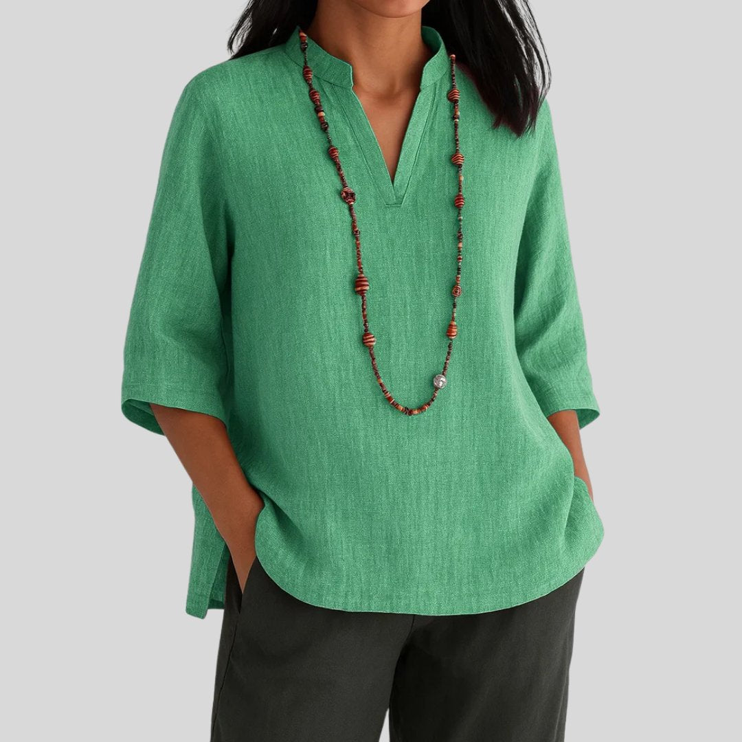 Women's relaxed V-neck tunic top with stylish split hem. Perfect for casual wear & everyday comfort. Longline, 3/4 sleeve.