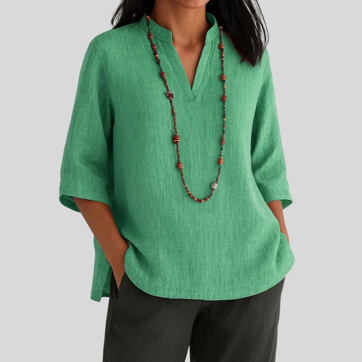 Women's relaxed V-neck tunic top with stylish split hem. Perfect for casual wear & everyday comfort. Longline, 3/4 sleeve.
