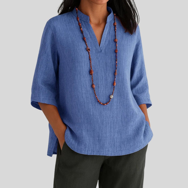 Timeless women's relaxed fit V-neck tunic with split hem. Versatile top for summer style & easy, casual wear. Comfortable.
