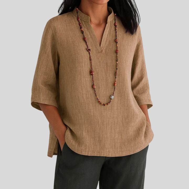 Comfortable women's relaxed V-neck tunic top, featuring a flattering split hem. Ideal for casual, everyday fashion & summer.