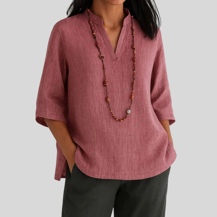 Casual women's longline tunic top with a relaxed V-neck & modern split hem. Easy wear, three quarter sleeve for comfort.