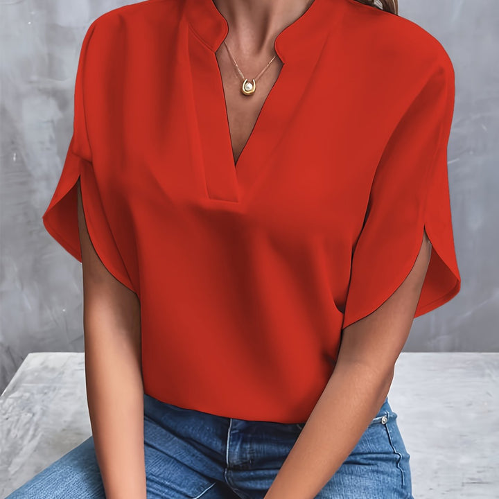 Timeless women's v-neck blouse, batwing sleeves, and loose fit, perfect as an elegant fashion top.