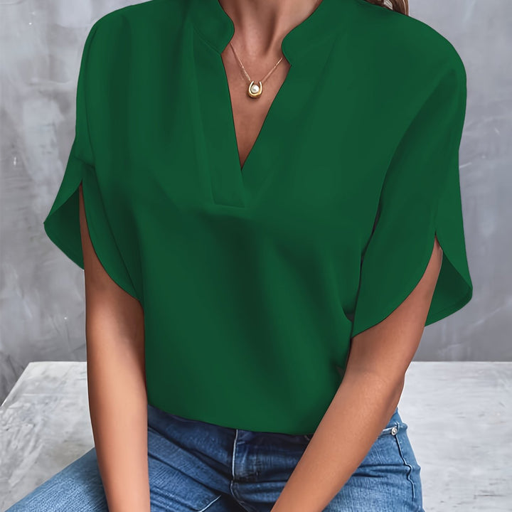 Elegant women's v-neck blouse, batwing sleeves create a flowing silhouette, perfect for a stylish look.