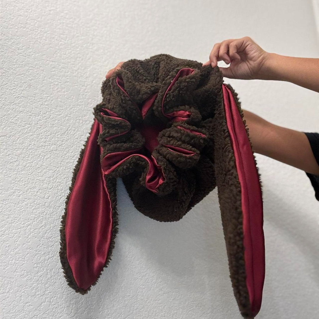 Women's warm bunny hat, cozy pink bonnet with adorable ear design.