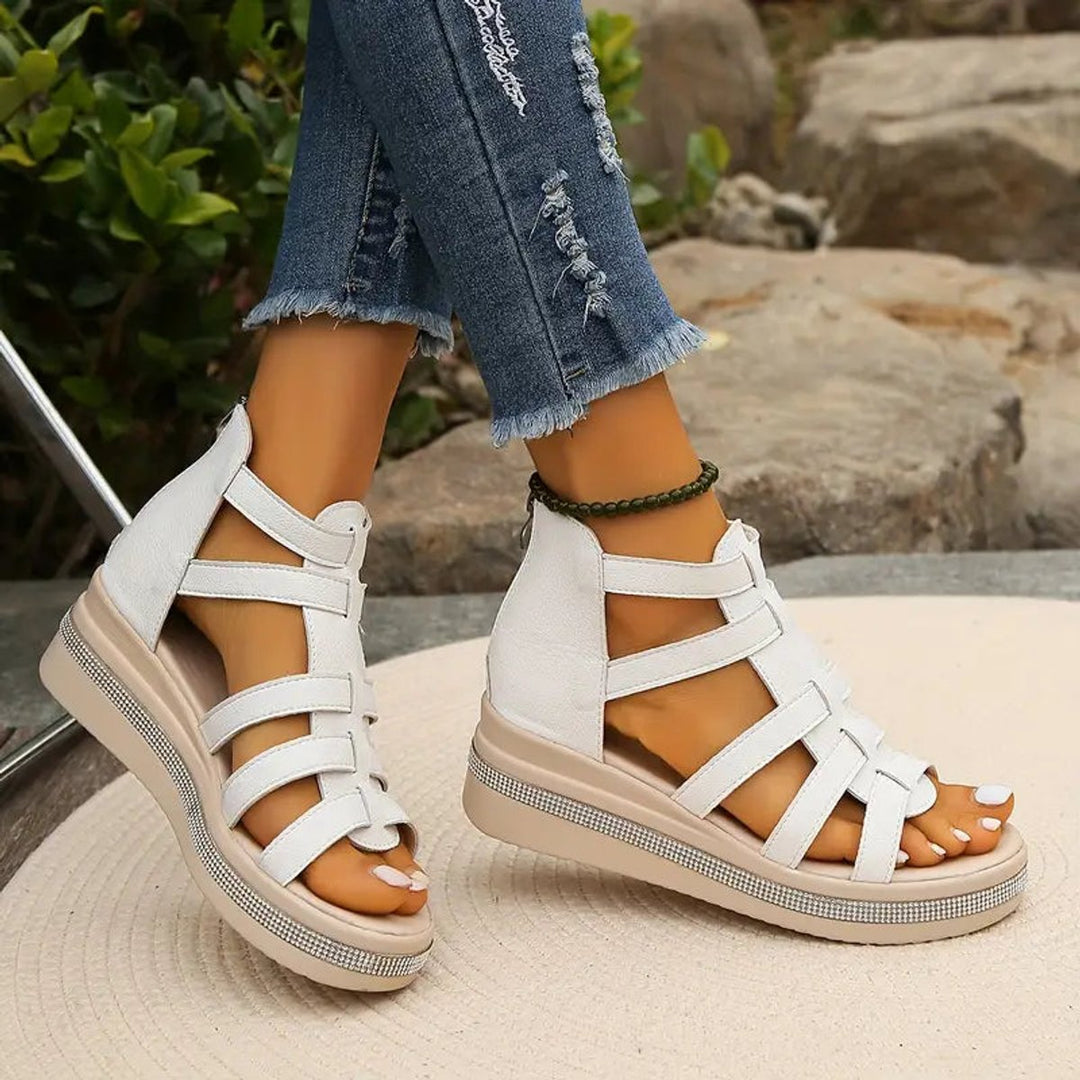Open-toe gladiator orthopedic shoes for women, offering arch support and adjustable straps.