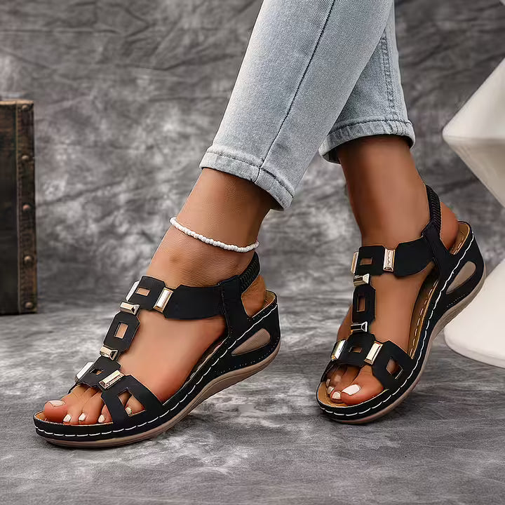 White platform sandals with ankle strap, open toe, perfect for warm weather fashion statement.