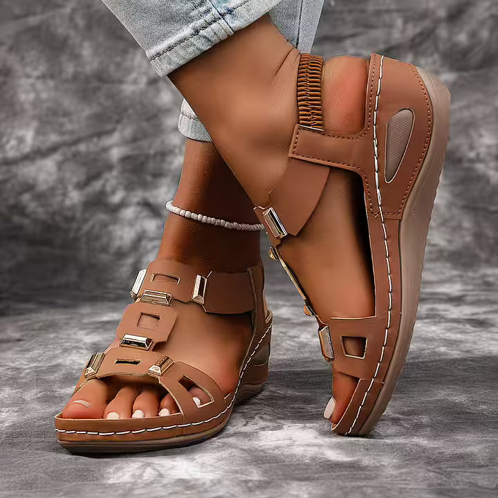 Elegant black platform sandals with secure ankle strap, stylish for casual or dressy occasions.
