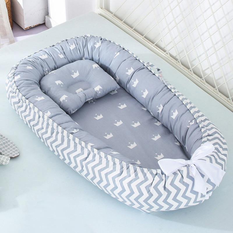 All-in-one portable baby lounger, infant nest, and safe sleeper. Essential baby bed for travel & comfortable nursery use.