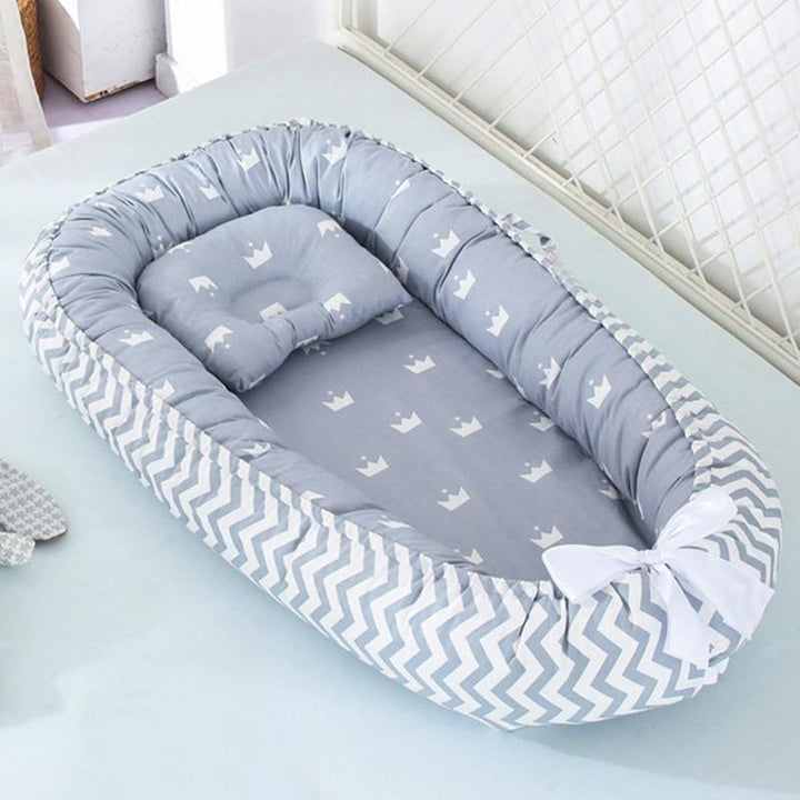 All-in-one portable baby lounger, infant nest, and safe sleeper. Essential baby bed for travel & comfortable nursery use.