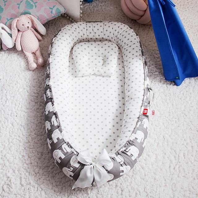 Soft baby lounger & tummy time mat for newborns. Portable snuggle nest provides comfort & a safe baby bed for infants.