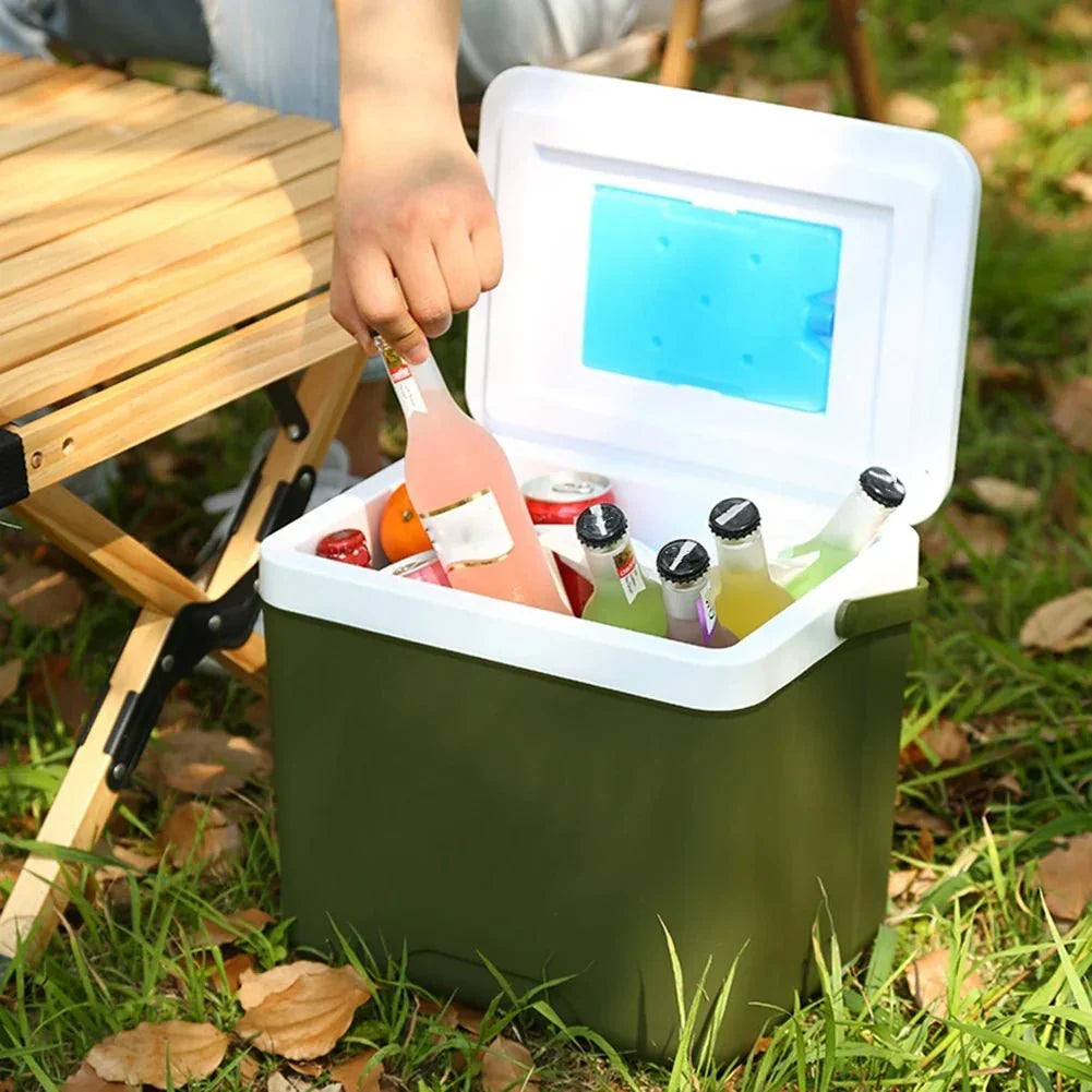 Compact electric cooler warmer with sturdy handle, perfect for camping gear and keeping snacks fresh.
