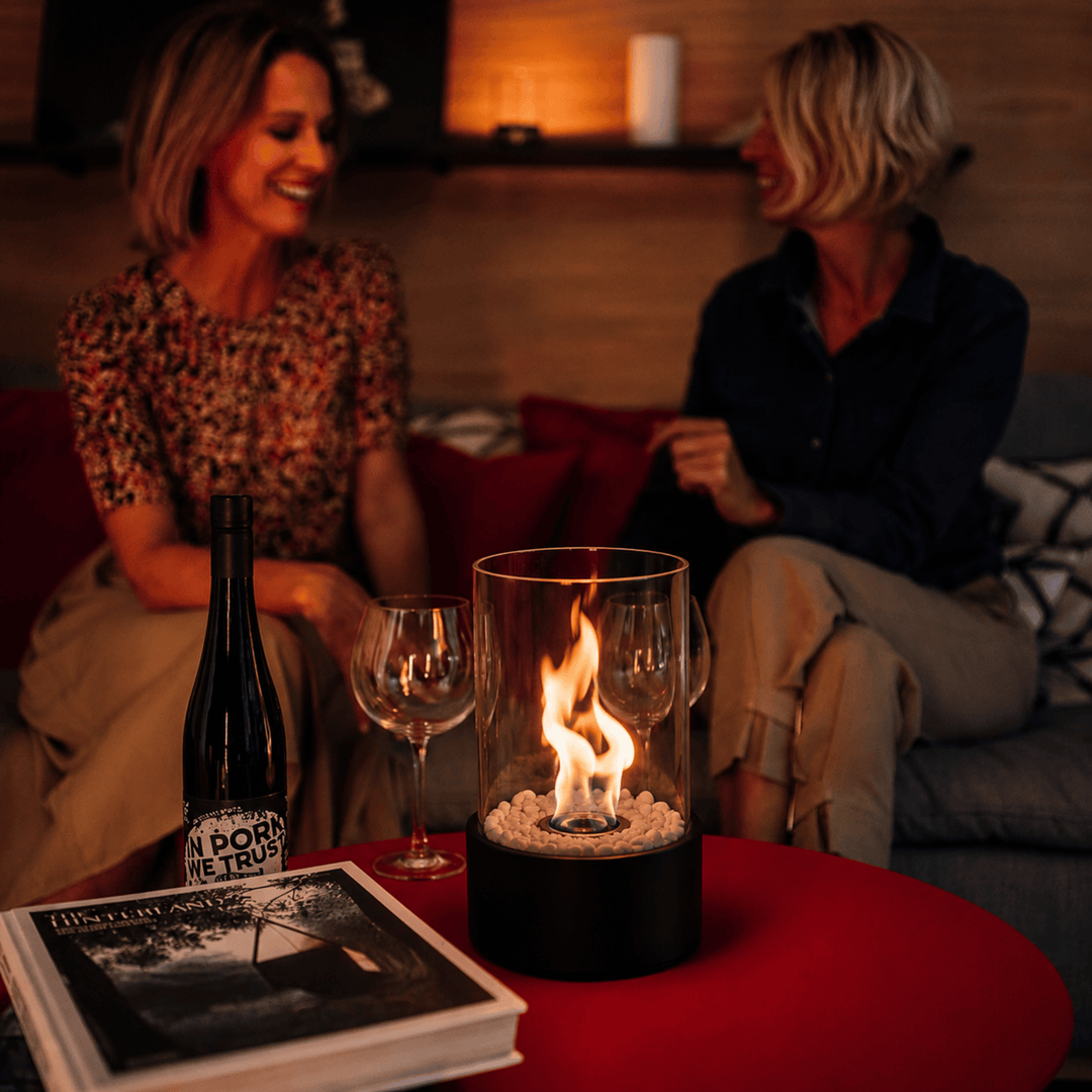 Versatile portable glass fireplace, perfect indoor/outdoor tabletop decor with a clean ethanol flame.