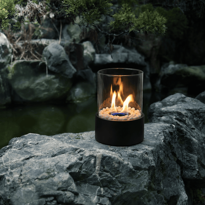 Cozy modern ambiance from a portable glass ethanol fireplace, tabletop decor for indoor & outdoor.