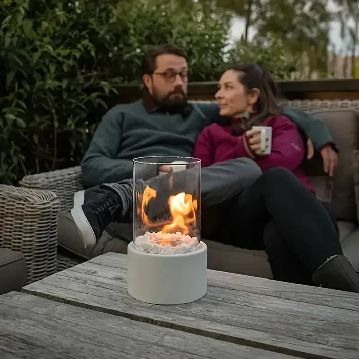 Mini portable patio heater and table fire lantern, enhancing outdoor ambiance.