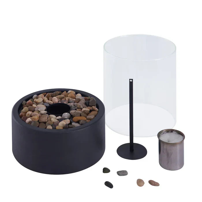 Sleek table fire lantern with steel base & glass, providing cozy ambiance indoors or out.